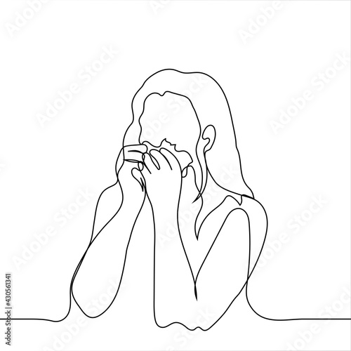 Woman crying holding a handkerchief with both hands to her face - one line drawing. An adult girl is crying in a handkerchief