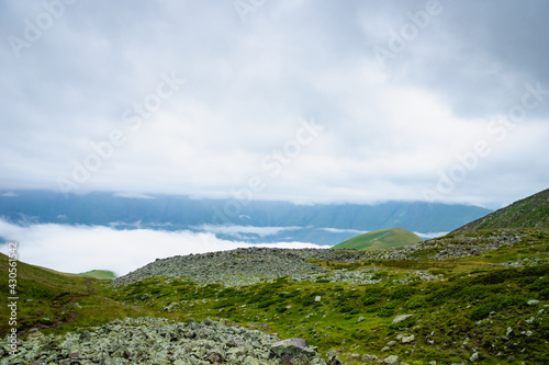 highland mountain landscape with copy space - nature, outdoor, adventure, trekking, hiking, mountaineering concept image in mount Kazbegi, Georgia