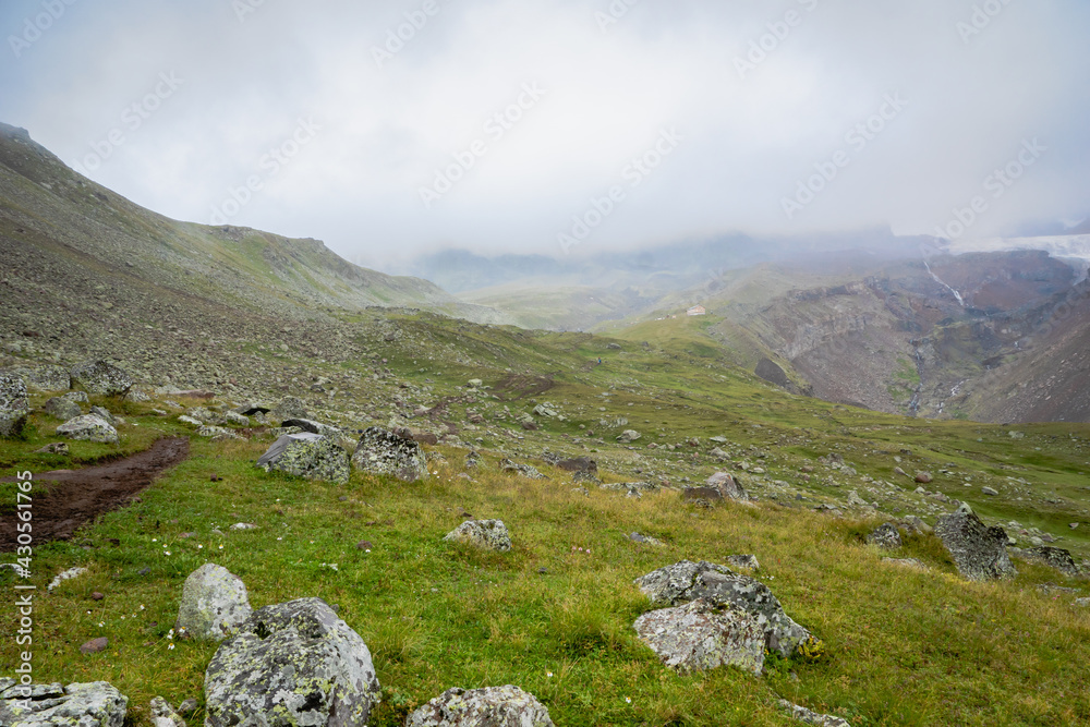 highland mountain landscape with copy space - nature, outdoor, adventure, trekking, hiking, mountaineering concept image in mount Kazbegi, Georgia