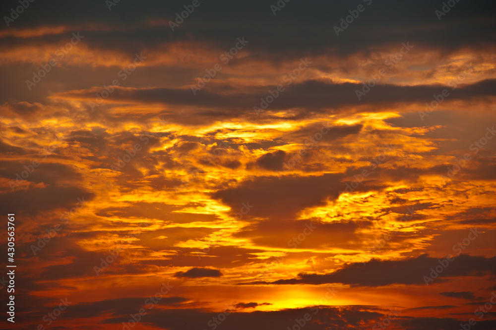 Beautiful sunset sky, yellow clouds