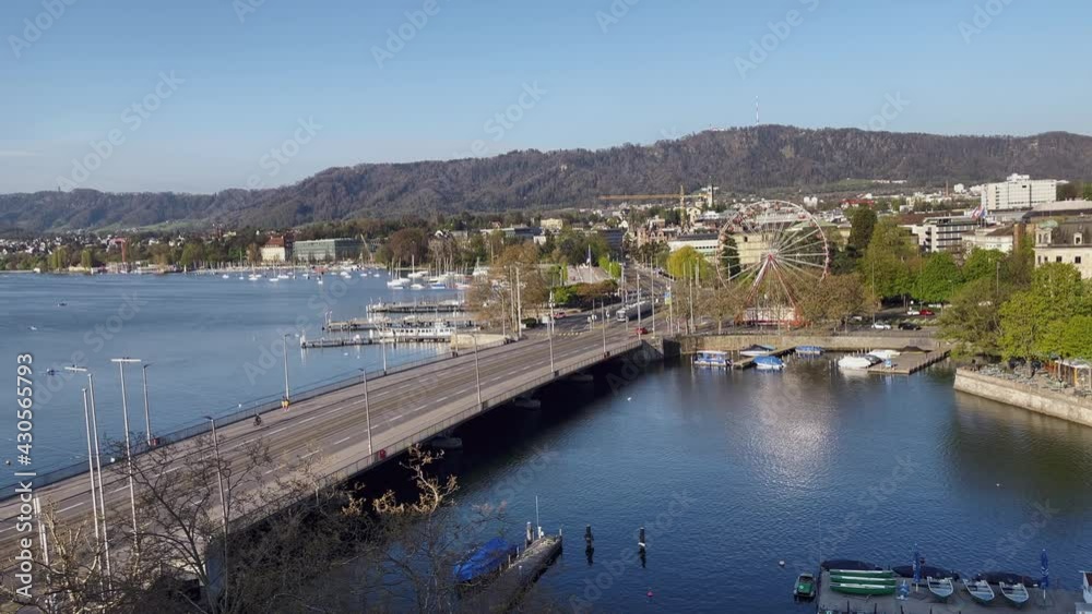 Aerial View of Zurich City and Lake with blue tram over the bridge. Aerial View of Zurich City and Lake with blue tram over the bridge.