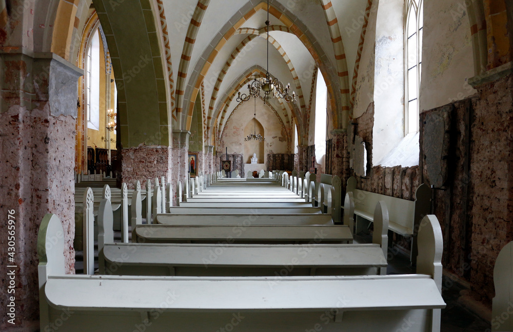 Parish benches in the old St. John's Church in Cesis, Latvia
