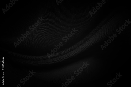 Black fabric sheets background or texture, abstract with waves, Soft focus cloth silk black