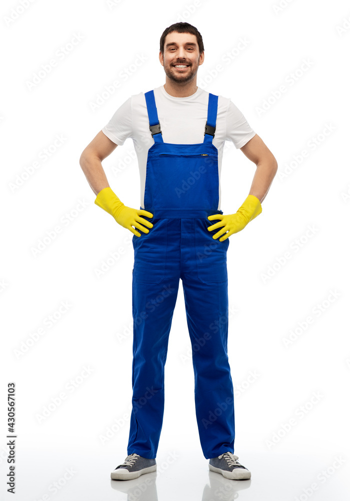 profession, cleaning service and building - happy smiling male worker or cleaner in overal and gloves over white background profession, cleaning service and building - happy smiling male worker or cleaner in overal and gloves over white background
