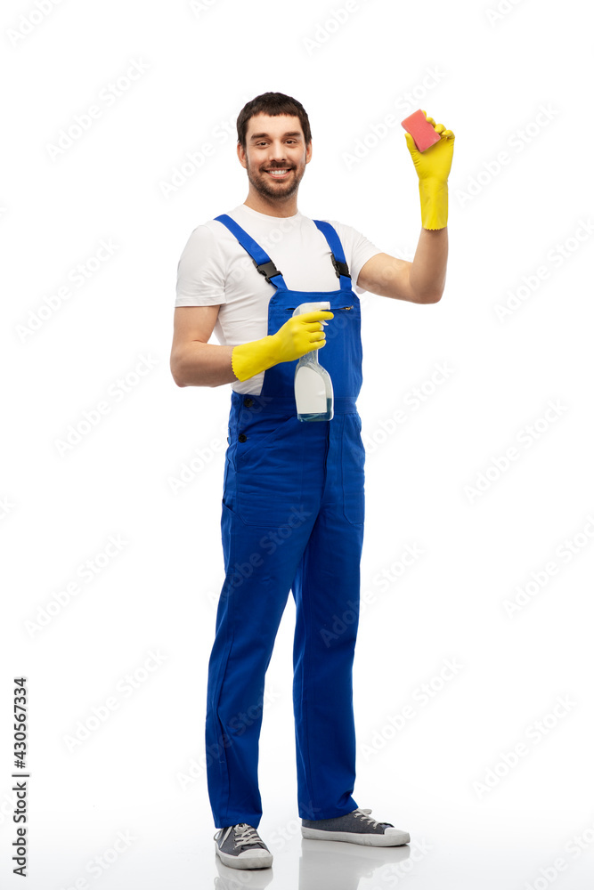 profession, cleaning service and people - happy smiling male worker or cleaner in overal and gloves with sponge and detergent over white background profession, cleaning service and people - happy smiling male worker or cleaner in overal and gloves with sponge and detergent over white background