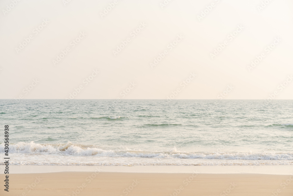 Sea and sand on tropical beach for background.