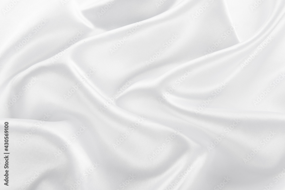 Fototapeta premium Abstract white silk fabric texture background. Cloth soft wave. Creases of satin