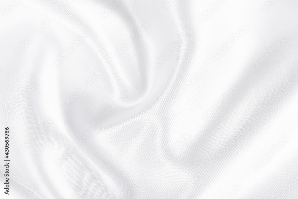 Abstract white silk fabric texture background. Cloth soft wave. Creases of satin
