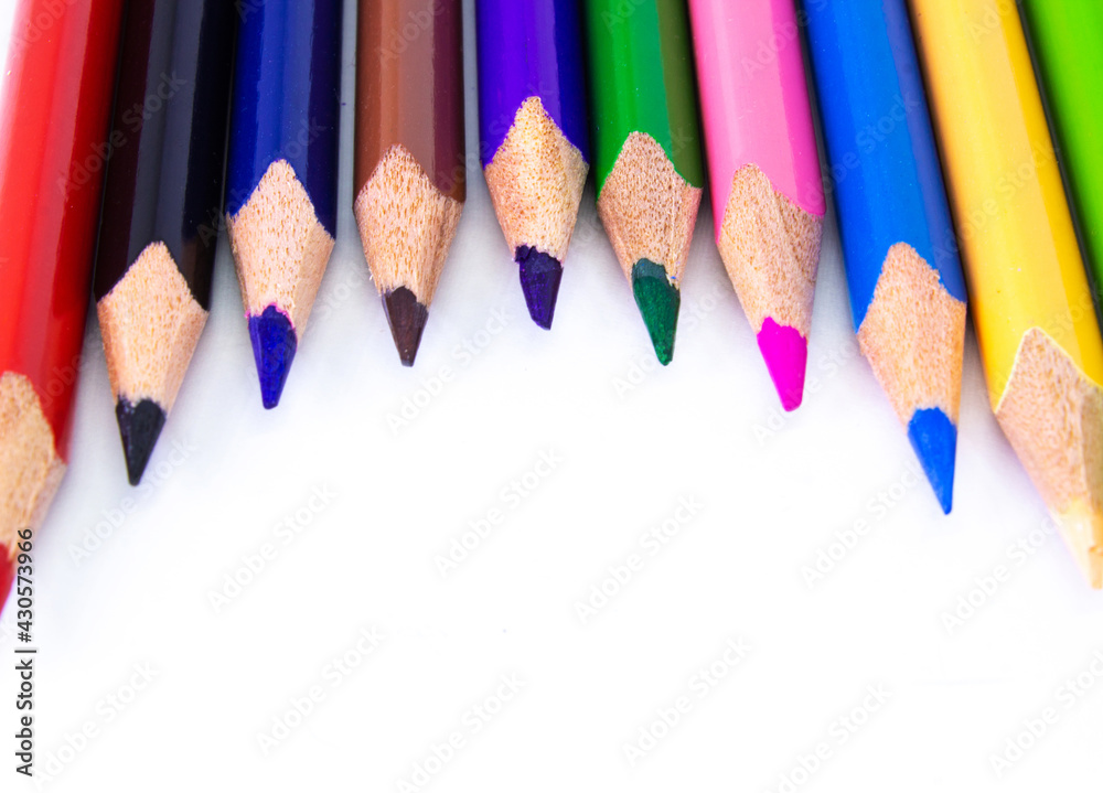 Close up macro shot of color pencil pile pencil nibs, used pencils from a school art room.