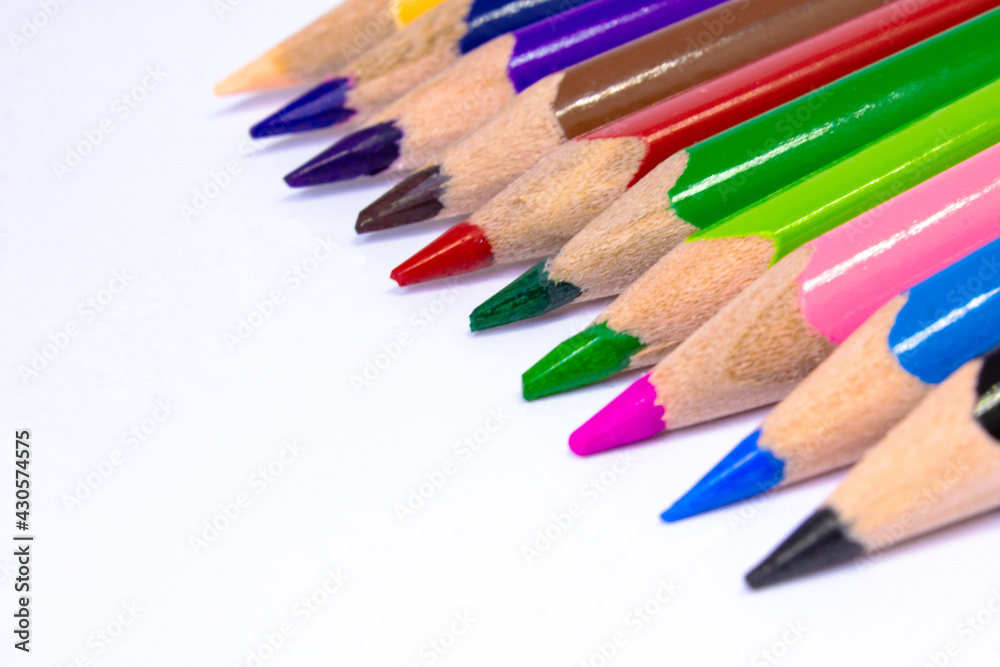 Close up macro shot of color pencil pile pencil nibs, used pencils from a school art room. Close up macro shot of color pencil pile pencil nibs, used pencils from a school art room.