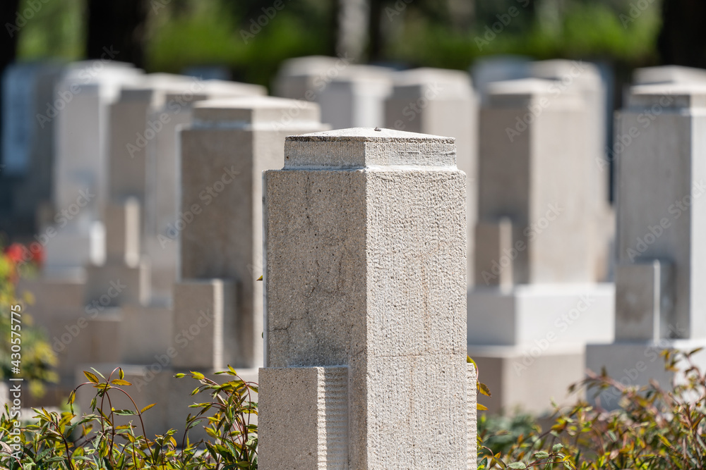 Many tombs in rows, graves on military  cemetery