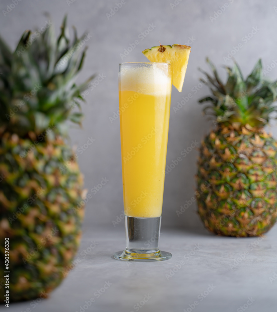 Refreshing freshly made fruit juice on a glass , fresh pineapple juice. Refreshing freshly made fruit juice on a glass , fresh pineapple juice.