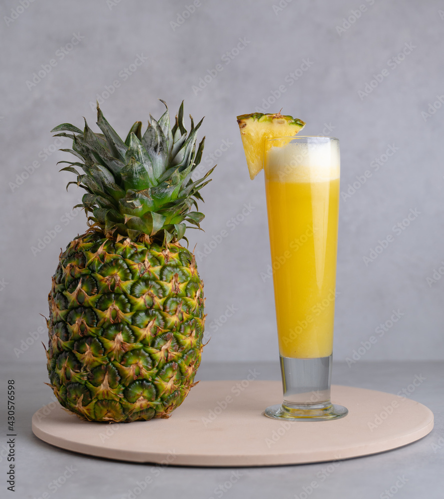 Refreshing freshly made fruit juice on a glass , fresh pineapple juice. Refreshing freshly made fruit juice on a glass , fresh pineapple juice.