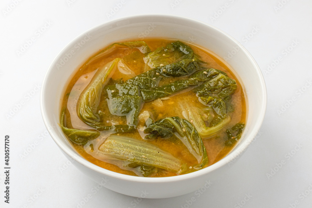 Young cabbage miso soup on a white background Young cabbage miso soup on a white background
