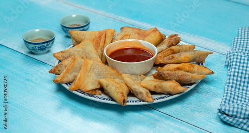 Mini samosa desi food Pakistani and Indian food with tomato ketchup
