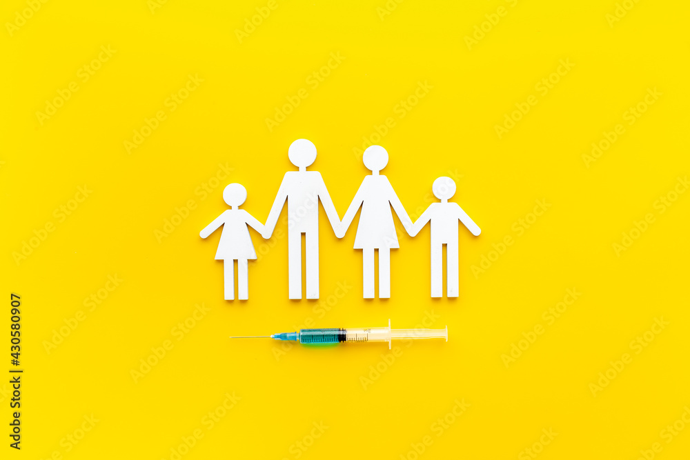 Vaccination concept with family shape. Vaccine vial dose in syringe Vaccination concept with family shape. Vaccine vial dose in syringe
