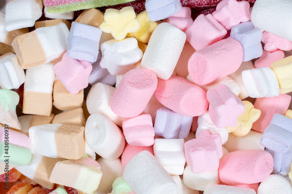 many colored marshmallows. candy background. a lot of sweet snacks. many colored marshmallows. candy background. a lot of sweet snacks.