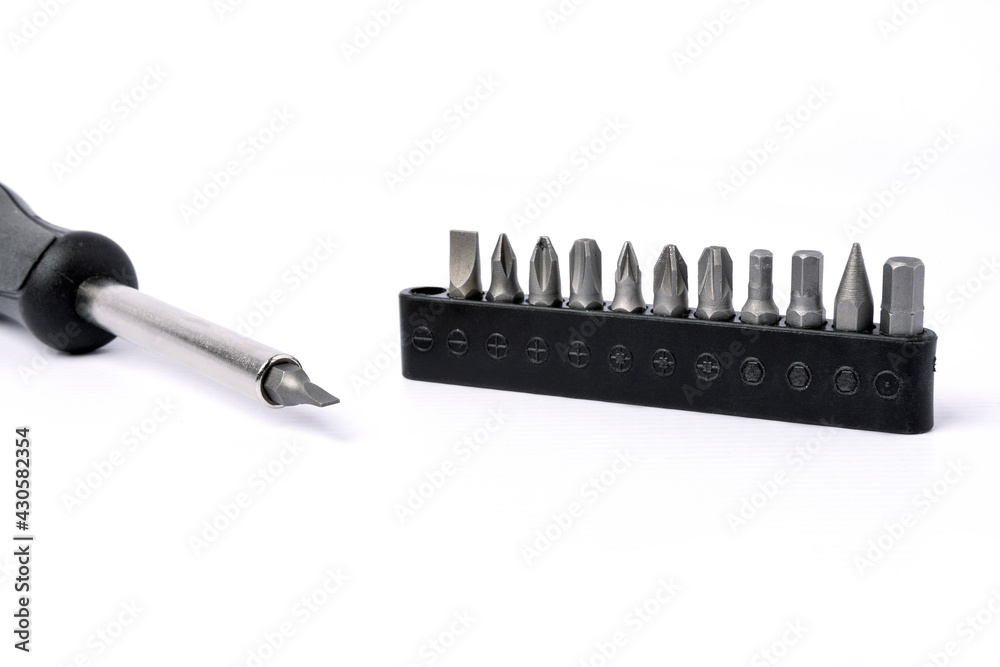 Screwdriver with magnetic bit holder set on white background.
Screwdriver with magnetic bit holder set on white background.