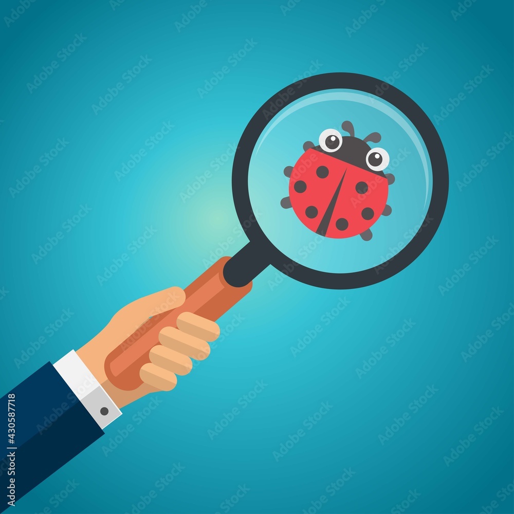Hand holding a magnifying glass with lady bug Hand holding a magnifying glass with lady bug