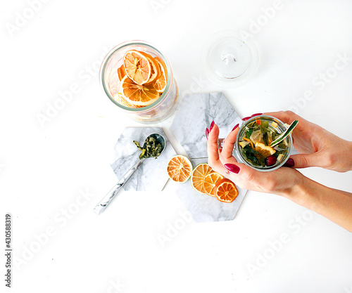 dried fruit in a jar and on the table. vegetarianism and healthy eating. energy for all time from healthy food. beautiful fruits in jars. weight loss. orange white glass. High quality photo