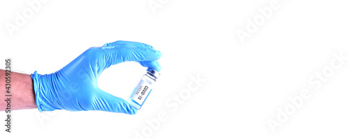 Covid-19 vaccine in hand on white background. Space for text
