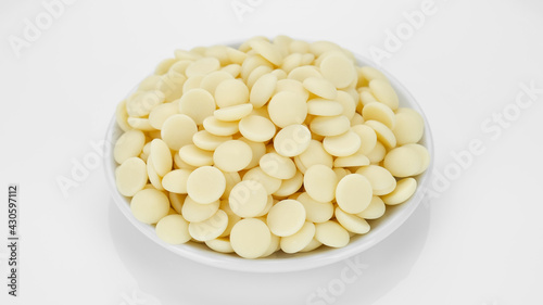 white chocolate chips isolated on white background, top view