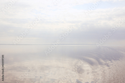 Pure lake surface background  natural blue and white background