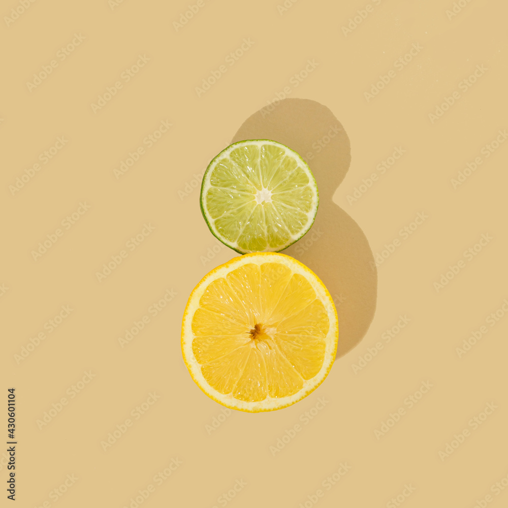 colorful design with lemon-lime on a sandy summer background.yellow and green minimal concept colorful design with lemon-lime on a sandy summer background.yellow and green minimal concept