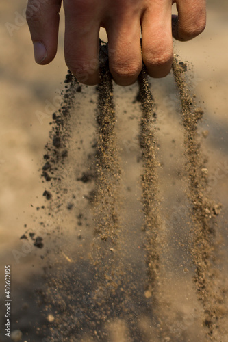 фотографія dry soil falling out of hand. drought concept