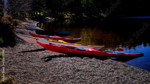 Canoe and kayaks on the shores of Loch Migdale in the Highlands