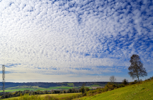 North Downs near Otford in Kent, UK. Scenic view of the English countryside with blue sky and white clouds. Otford is located on the North Downs Way and is a good base for exploring the countryside. photo