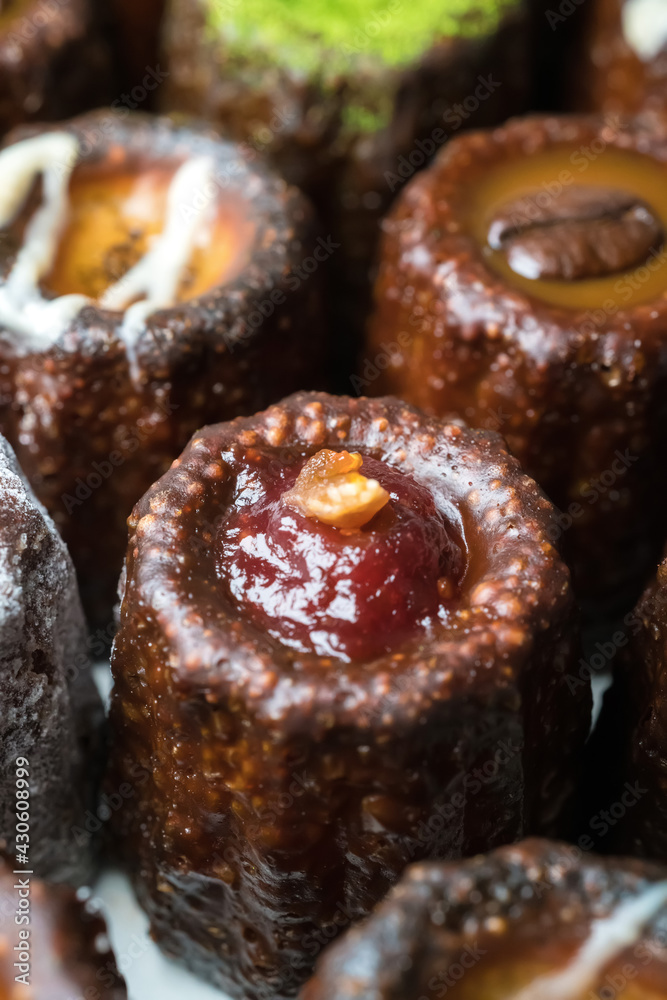 Caneles de bordeaux is a small pastry with rum and vanilla, traditional French sweet dessert. Caneles de bordeaux is a small pastry with rum and vanilla, traditional French sweet dessert.