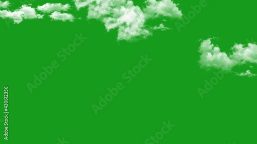 A 4K footage of white fluffy clouds on a green screen