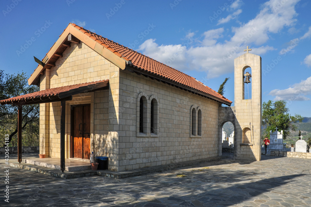 In a picturesque valley among the mountains of Cyprus stands alone church in the village churchyard     