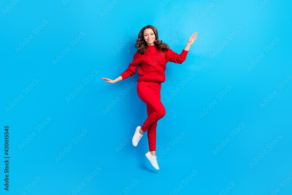 Full length body size view of attractive cheerful girl jumping up isolated over bright blue color background Full length body size view of attractive cheerful girl jumping up isolated over bright blue color background
