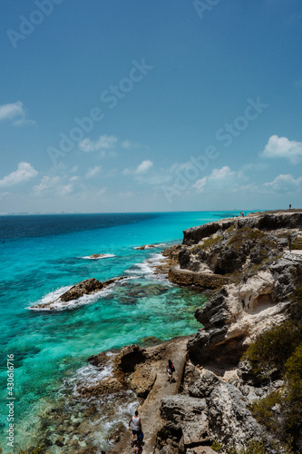 Isla Mujeres, Mexico cliff and water with blue colours. Sunny weather.