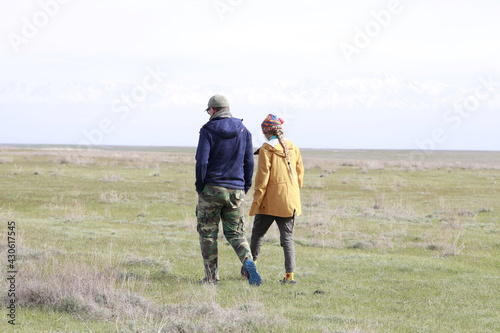 The father and daughter walk together 