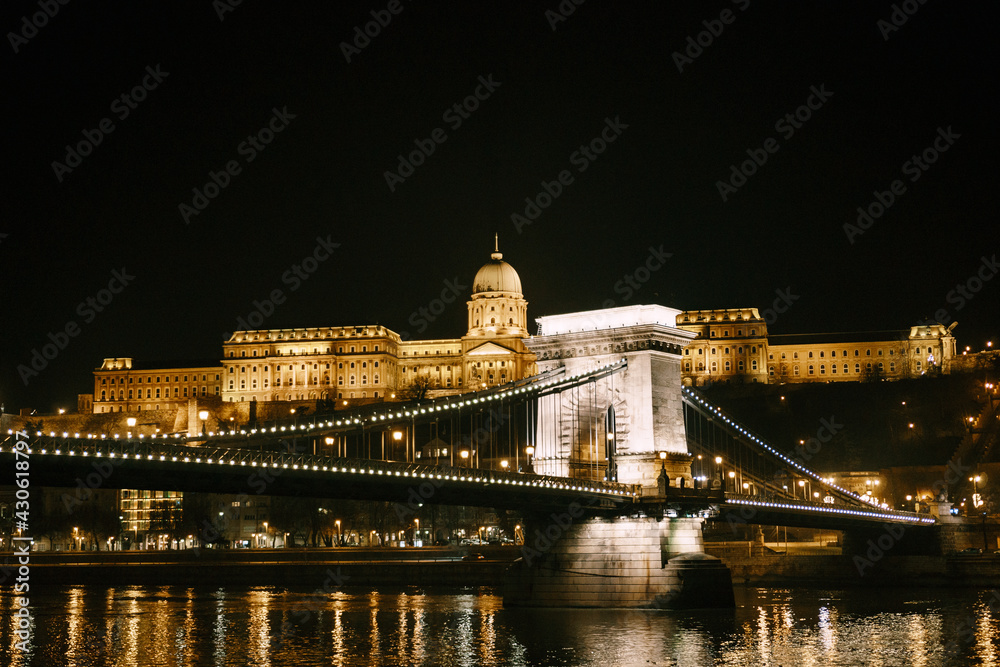 Beautiful night illumination on the Szechenyi chain bridge in Budapest