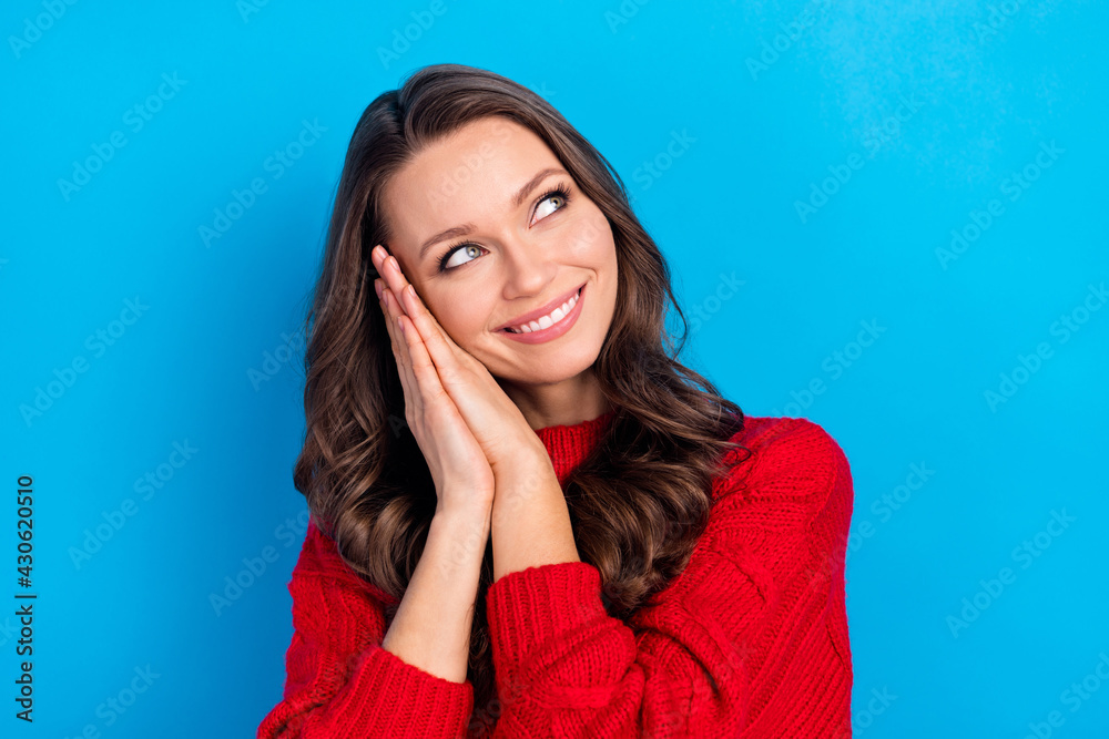 Portrait of attractive cute cheerful girl dreaming resting isolated over bright blue color background