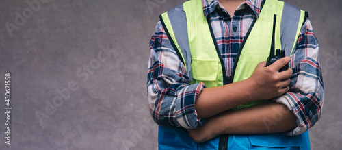 Professinal of workers holding walkie talkie before engineers check and rested project on site. Teamwork engineer work together in a construction building. photo