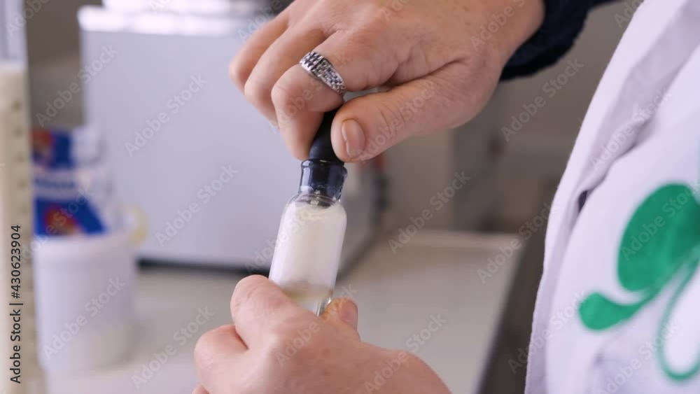 analysis of milk in the laboratory. close-up of checking milk in the laboratory. analysis of milk in the laboratory. close-up of checking milk in the laboratory.