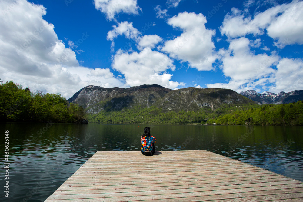 Woman enjoying day next to Bohinj lake in Slovenia, 