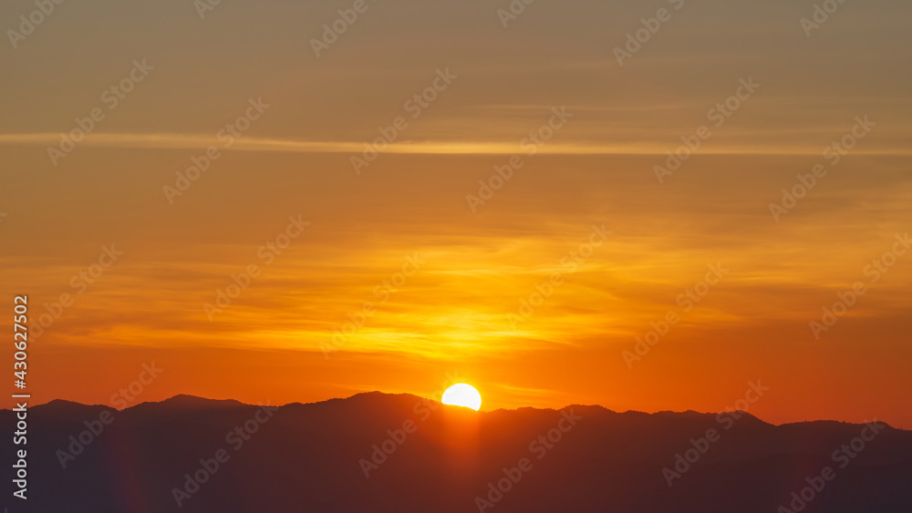 Sunrise or sunset over mountain hill forest with circle Lensflare.
