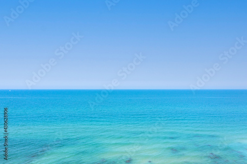 Crystal clear ocean water with blue sky, Aerial image.