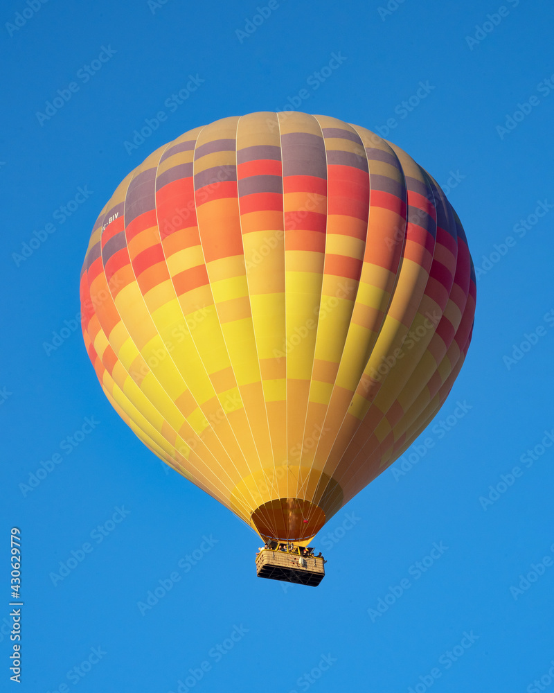 Naklejka premium Colorful Hot Air Balloon Flying Over Göreme, Cappadocia 
