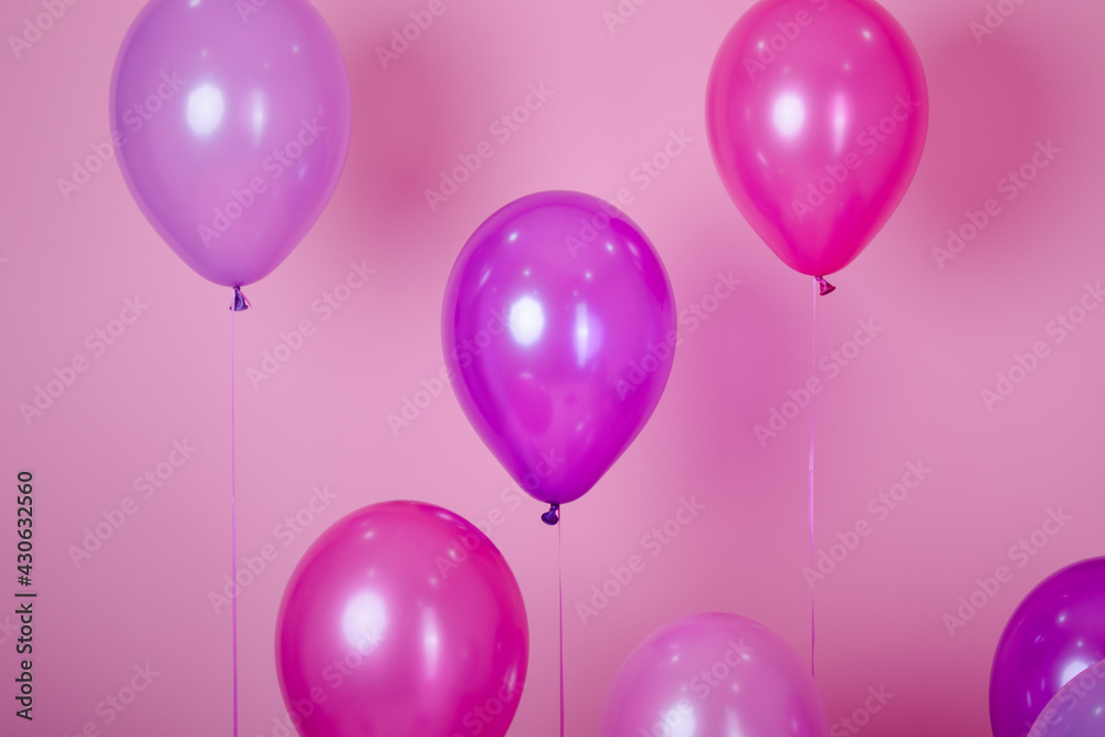 floating Colorful pink party balloons on pink pastel background. Space for text. Minimal idea creative concept of happiness, joy, birthday. holiday web banner with copy space floating Colorful pink party balloons on pink pastel background. Space for text. Minimal idea creative concept of happiness, joy, birthday. holiday web banner with copy space