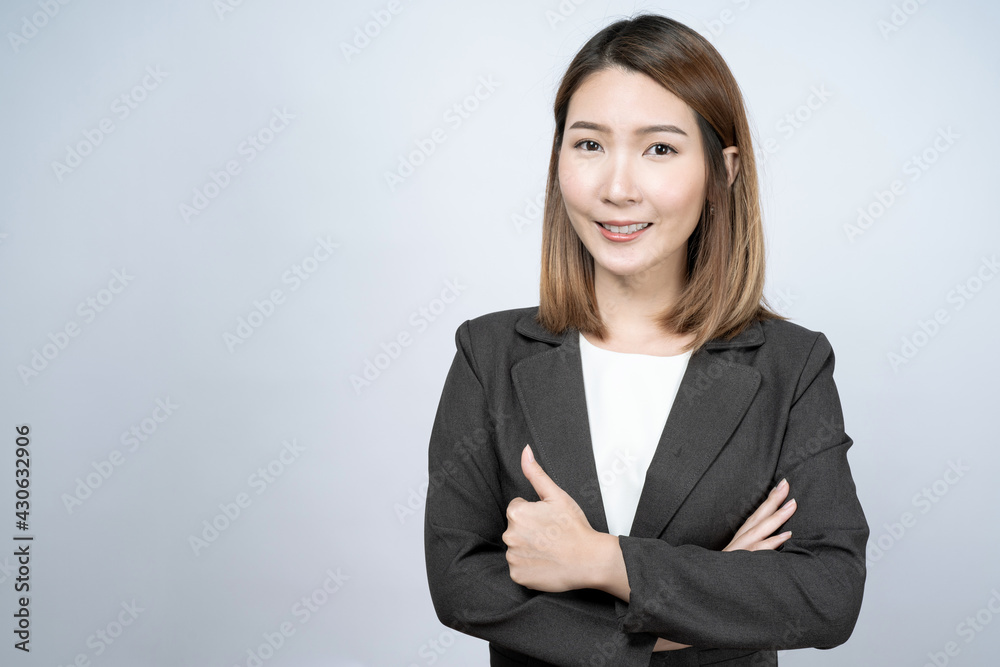 Beautiful Asian businesswoman in a black suit, isolated on a white background. Beautiful Asian businesswoman in a black suit, isolated on a white background.
