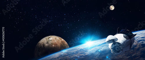 Space   station on orbit of the Earth planet and universe background. Elements of this image furnished by NASA