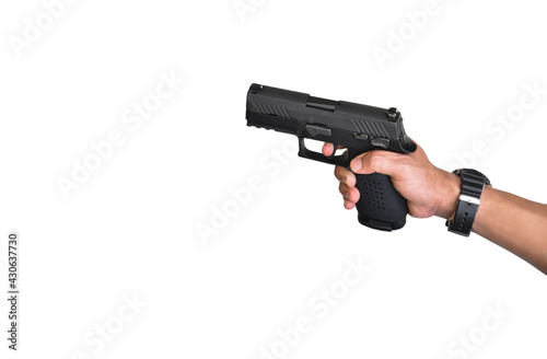 automatic black 9mm pistol holding in hand, ready to shoot, seascape background, concept for security, bodyguard, mafia, gangster, robbery and safety at the sea around the world.