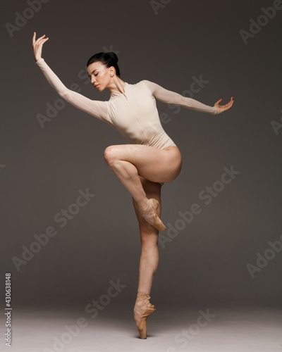 Young beautiful skinny ballerina is posing in studio © Alexander Y